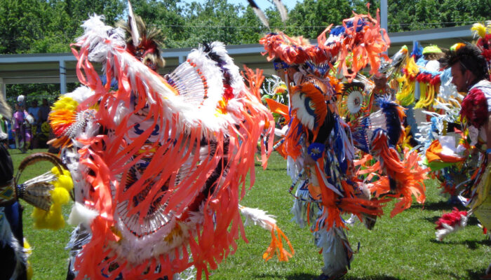 Dancers at Prairie Band Potawatomi Nation Pow Wow Dancers wearing elaborate outfits